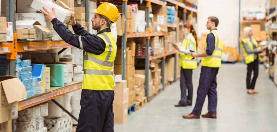 Warehouse,Worker,Taking,Package,In,The,Shelf,In,A,Large